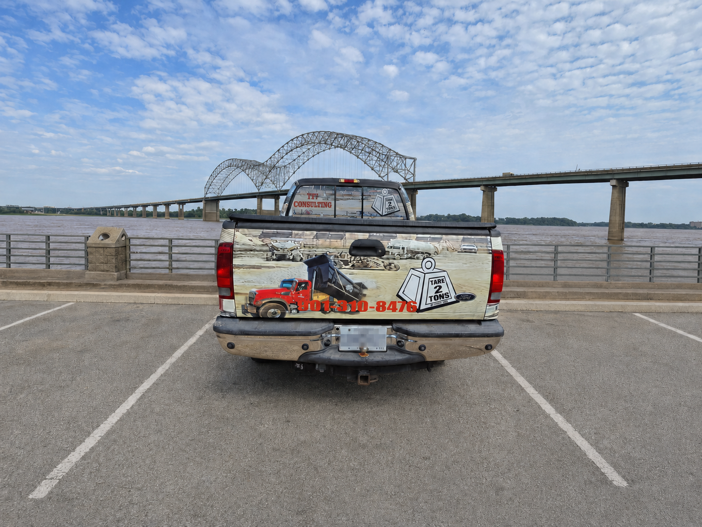 Rear view of the Tare 2 Tons Xpress advertising pickup at the Memphis riverfront