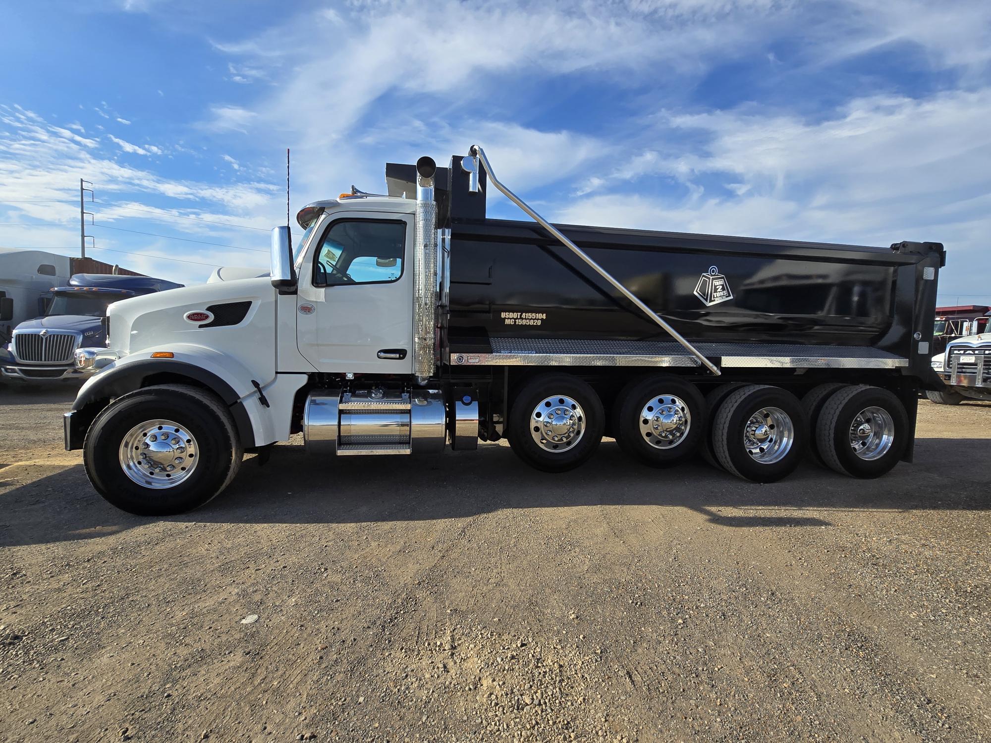 White Tare 2 Tons Xpress quad-axle dump truck